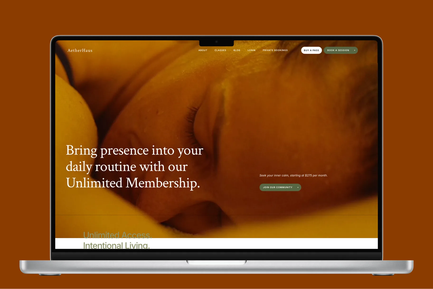 AetherHaus membership website presented on a MacBook against a warm brown background